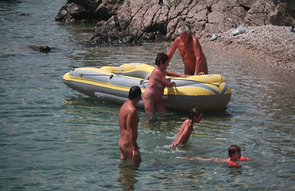 Lone Nudist in Yellow Boat photos Nudism naturism club