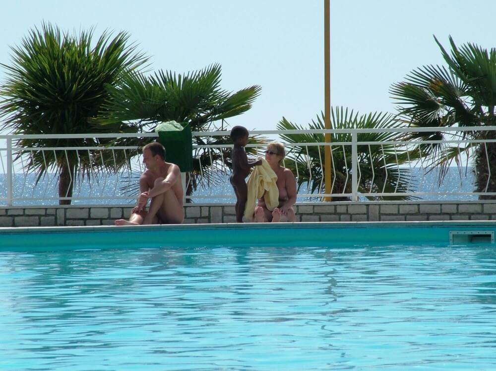 Photo of naturists in an outdoor pool Nudism naturism club