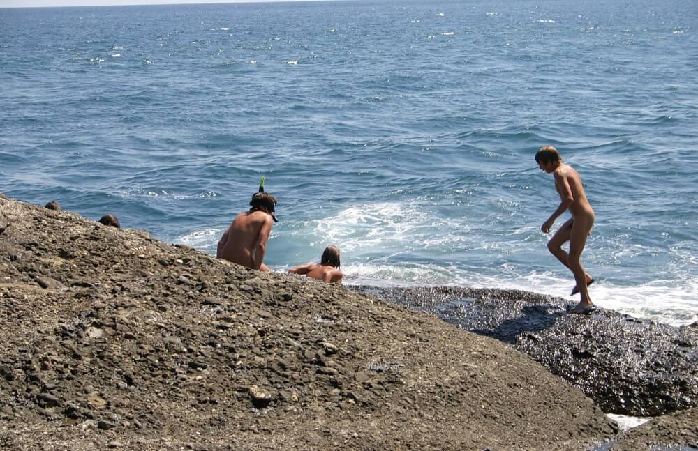 Leaning Against Hit Rocks pics Nudism naturism club